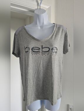 Bebe Sport loose fitting gray Short Sleeve V-Neck Logo Tee with sheer shoulders